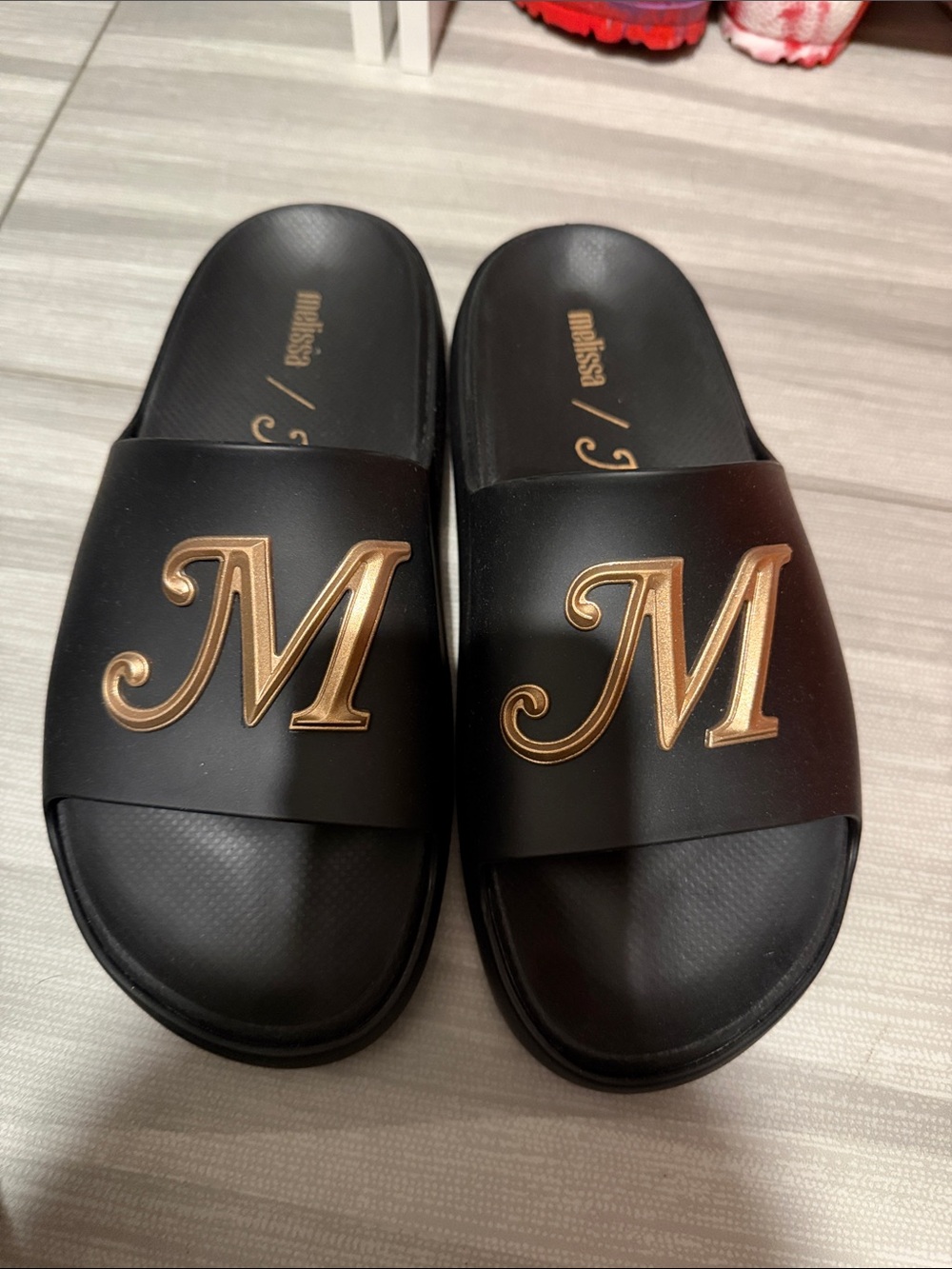 Melissa Black Slides with Gold 'M' Monogram